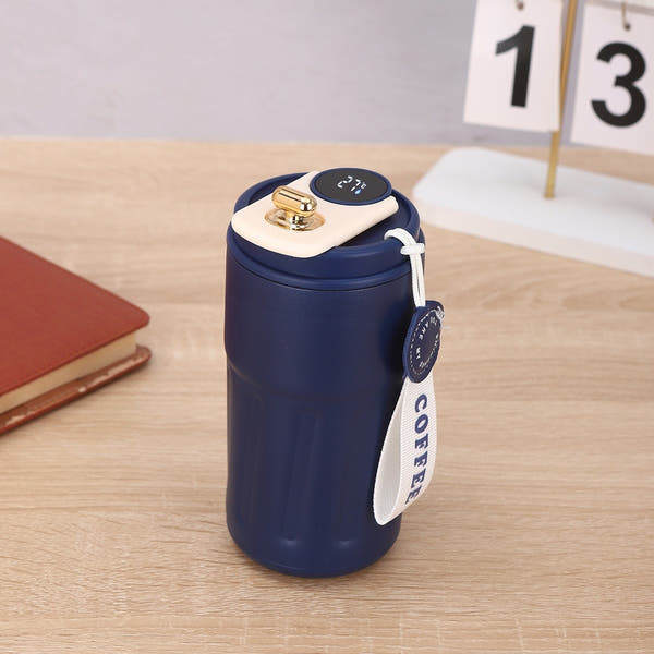 A blue coffee tumbler with a white and gold top, a temperature display, and a white 